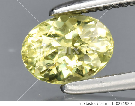 natural yellow grossular garnet gem on the background natural yellow grossular garnet gem on the background 110255920