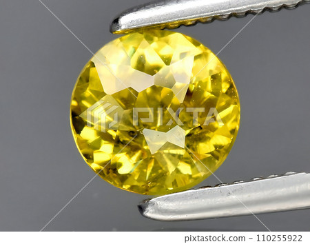 natural yellow grossular garnet gem on the background natural yellow grossular garnet gem on the background 110255922