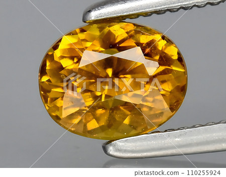 natural ornage grossualar garnet gem on the background 110255924