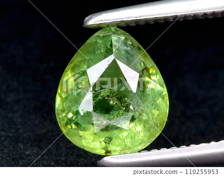 natural green demantoid garnet gem on the background natural green demantoid garnet gem on the background 110255953