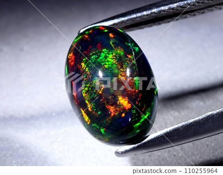 natural rainbow multicolor opal gem on the background 110255964