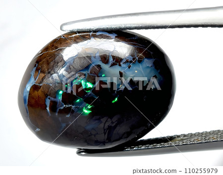 natural multicolor boulder opal gem on the background 110255979