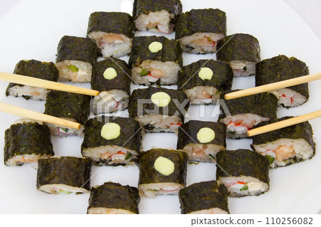Japanese cuisine, rice sushi and fish - closeup 110256082