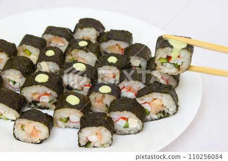 Japanese cuisine, rice sushi and fish - closeup 110256084