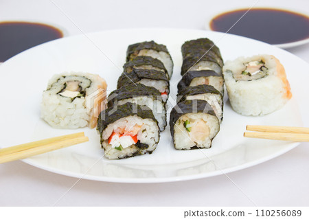 Japanese cuisine, rice sushi and fish - closeup 110256089