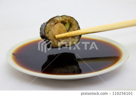 Japanese cuisine, rice sushi and fish - closeup Japanese cuisine, rice sushi and fish - closeup 110256101