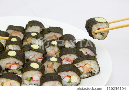 Japanese cuisine, rice sushi and fish - closeup 110256104