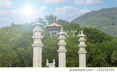 Pillars at a Buddhist temple Nanshan on soft sunlight, Sanya, China Pillars at a Buddhist temple Nanshan on soft sunlight, Sanya, China 110256359