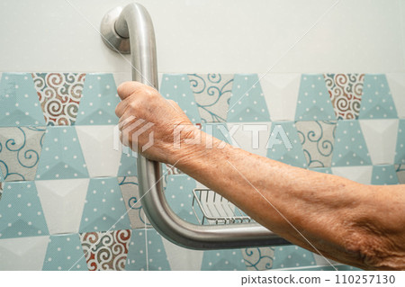 Asian elderly woman use bathroom handle security in toilet, healthy strong medical concept. 110257130