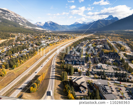 Aerial view of Trans-Canada Highway (Highway 1) exit 89 to Downtown Canmore in Canadian Rockies in a autumn sunny day. Alberta, Canada. Transportation concept. 110260363