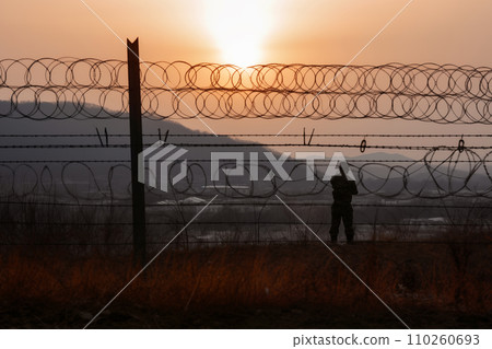 Border of South Kore and North Korea. Border with barbed wire on fence. 110260693