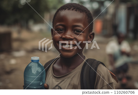 African boy with water bottle in hand. Black boy enjoying the water. 110260706