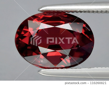 natural red rhodolite garnet gem on the background 110260821