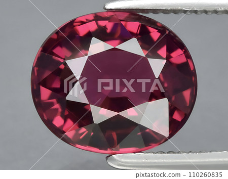 natural red rhodolite garnet gem on the background 110260835