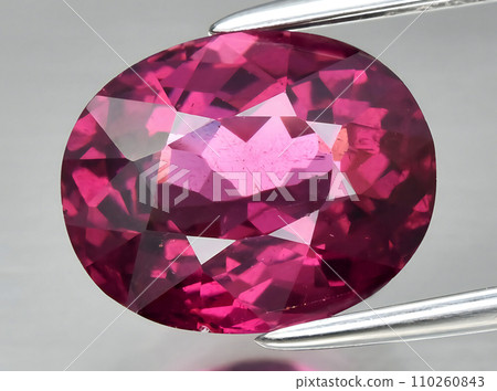 natural red rhodolite garnet gem on the background 110260843