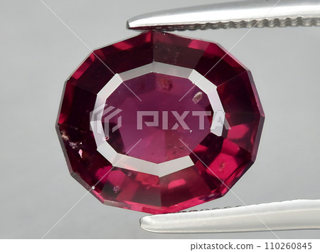 natural red rhodolite garnet gem on the background 110260845