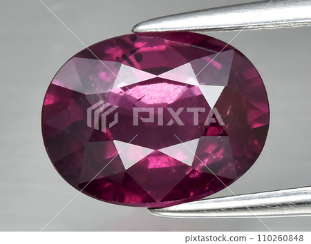 natural red rhodolite garnet gem on the background natural red rhodolite garnet gem on the background 110260848