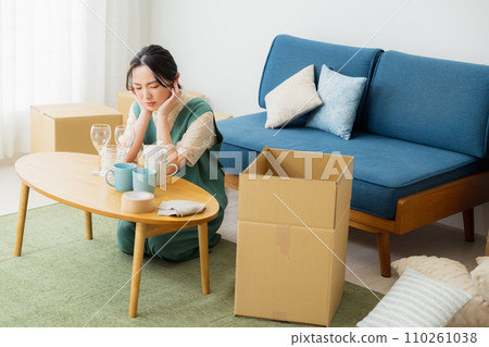 A woman preparing to move A woman preparing to move 110261038