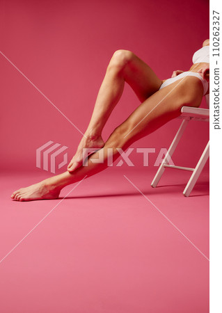 in white cotton underwear against pink studio background 110262327