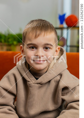 Portrait of happy smiling Caucasian preteen school boy child kid looking at camera, home play room Portrait of happy smiling Caucasian preteen school boy child kid looking at camera, home play room 110262590