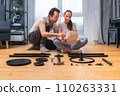 Husband and wife look through the instructions for assembling furniture together 110263331