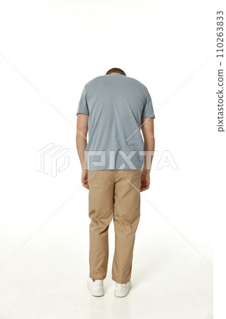 young man on white background, rear view 110263833