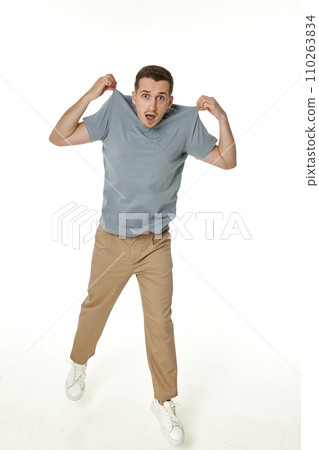 man holding himself by the shoulders isolated on white background 110263834