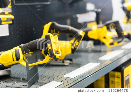 Power tools, drills and hammers of various manufacturers are sold in a hardware store. Power tools, drills and hammers of various manufacturers are sold in a hardware store. 110264478