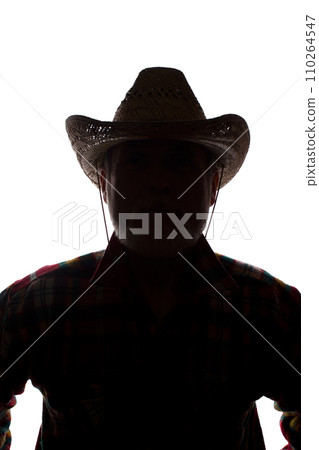 Old man in cowboy hat, front view - dark close-up silhouette 110264547