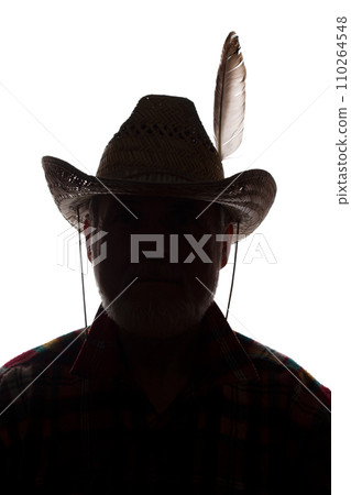 Old man in cowboy hat, front view - dark close-up silhouette Old man in cowboy hat, front view - dark close-up silhouette 110264548