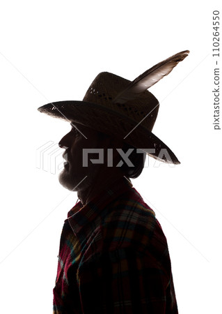 Old man in cowboy hat, side view - dark close-up silhouette Old man in cowboy hat, side view - dark close-up silhouette 110264550