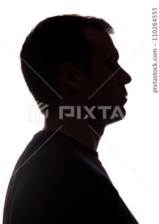 Portrait of a young man, side view - dark isolated silhouette Portrait of a young man, side view - dark isolated silhouette 110264555
