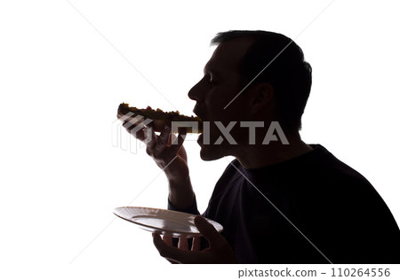 Portrait of a young man eat pizza, side view - silhouette Portrait of a young man eat pizza, side view - silhouette 110264556