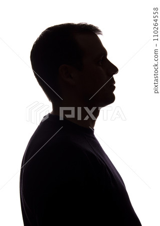 Portrait of a young man, side view - dark isolated silhouette 110264558