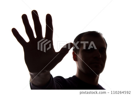 Hand young man covers his face, protest - silhouette, concept Hand young man covers his face, protest - silhouette, concept 110264592