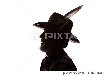 Old man in cowboy hat, side view - dark close-up silhouette Old man in cowboy hat, side view - dark close-up silhouette 110264606