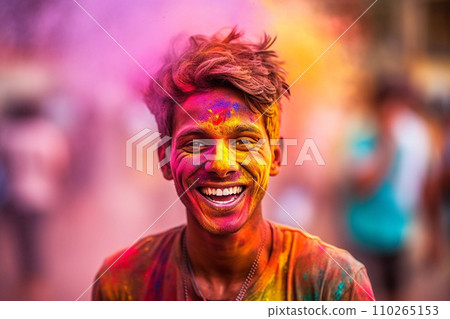 Portrait of young man in colorful powder on indian street, Holi festival Portrait of young man in colorful powder on indian street, Holi festival 110265153
