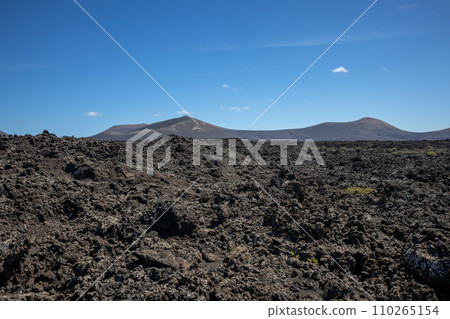 Volcanic soil and a mountain, Lanzarote, Spain Volcanic soil and a mountain, Lanzarote, Spain 110265154
