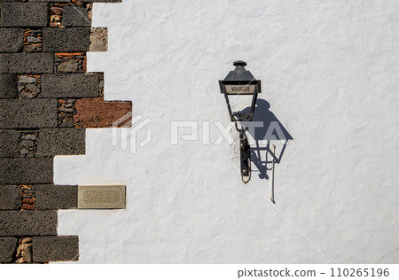 Classical lantern on a white wall, Teguise, Lanzarote Classical lantern on a white wall, Teguise, Lanzarote 110265196