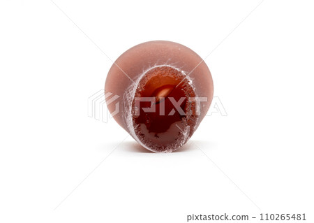 Closeup of cuberdon, a cone-shaped Belgian candy on a white background 110265481
