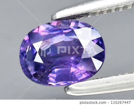 natural purple sapphire gem on the background 110267447