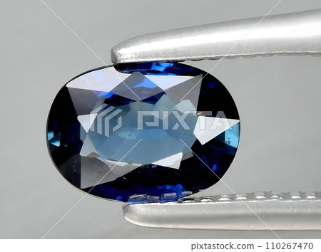 natural blue sapphire gem on the background natural blue sapphire gem on the background 110267470