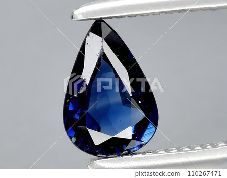 natural dark blue sapphire gem on the background 110267471