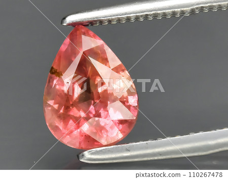 natural padparadscha sapphire gem on the background natural padparadscha sapphire gem on the background 110267478