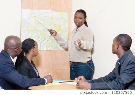 Businesswoman makes a presentation at the office at a meeting at work. 110267590
