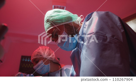 Medical staff try to revive the patient with cardiac massage Medical staff try to revive the patient with cardiac massage 110267904