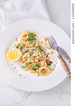 Lemon pasta with almonds 110268088