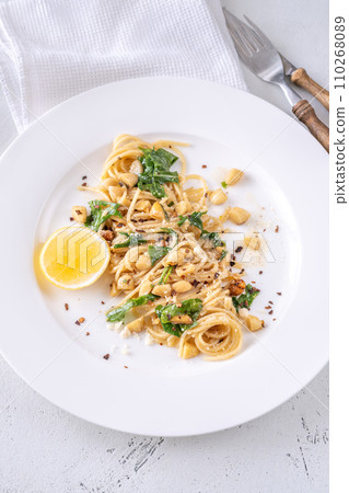 Lemon pasta with almonds 110268089