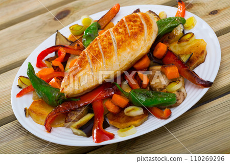 Bulgarian cuisine plakia, tasty chicken fillet and different baked vegetables 110269296