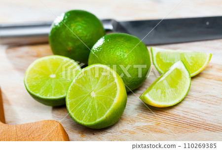 Sliced fresh juicy limes Sliced fresh juicy limes 110269385